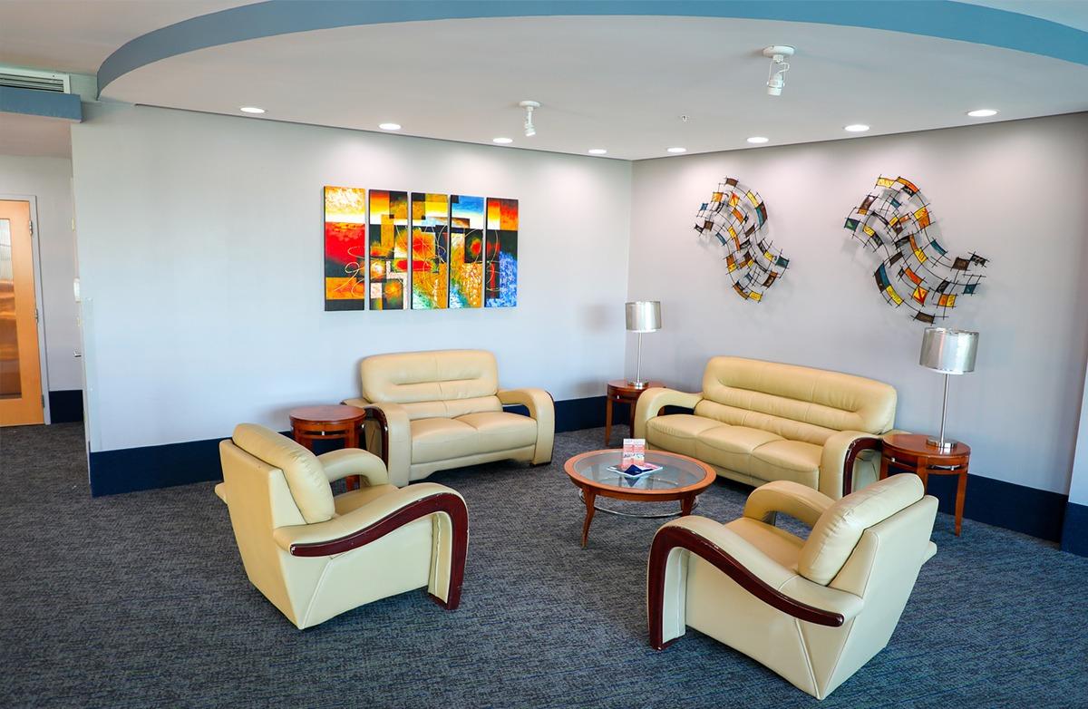 A relaxing area with comfortable chairs inside the Avista Resort