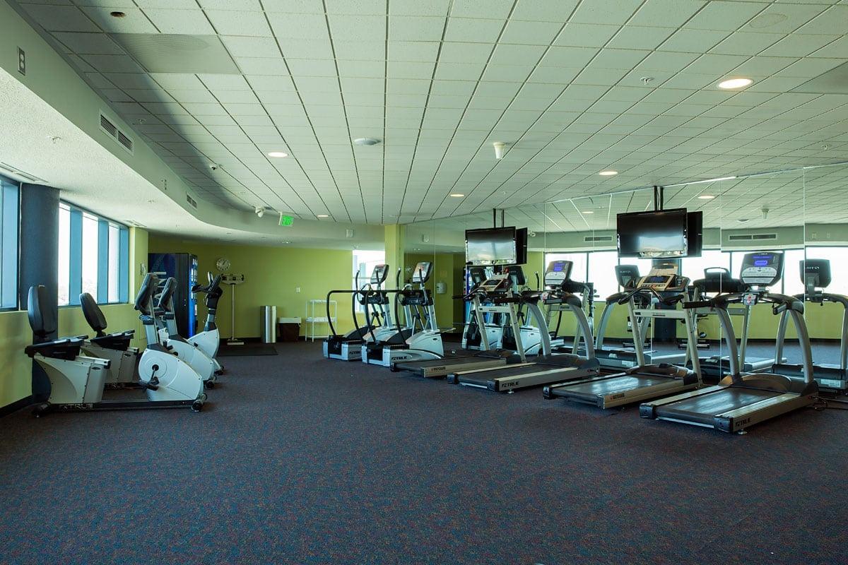 A wide shot of the gym at the Avista Resort with the treadmills in view