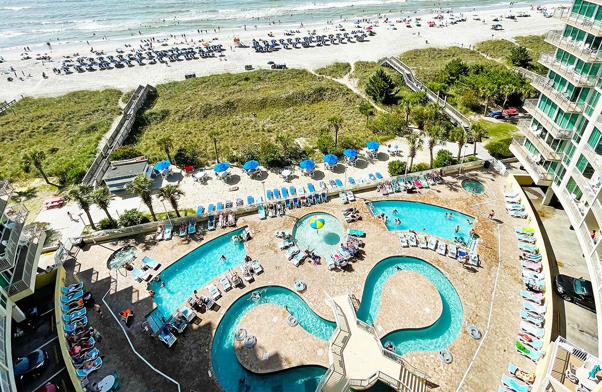 A birdseye view of the lazy review and outdoor pool of the Avista Resort. The beach is also seen