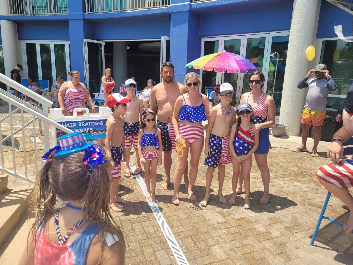 family with patriotic swimsuits at resort