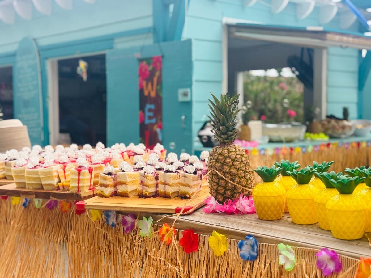 Wooden sign in the shape of a pumpkin that says welcome