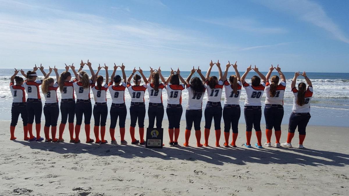 A sports group cheering on the beach near the Avista Resort